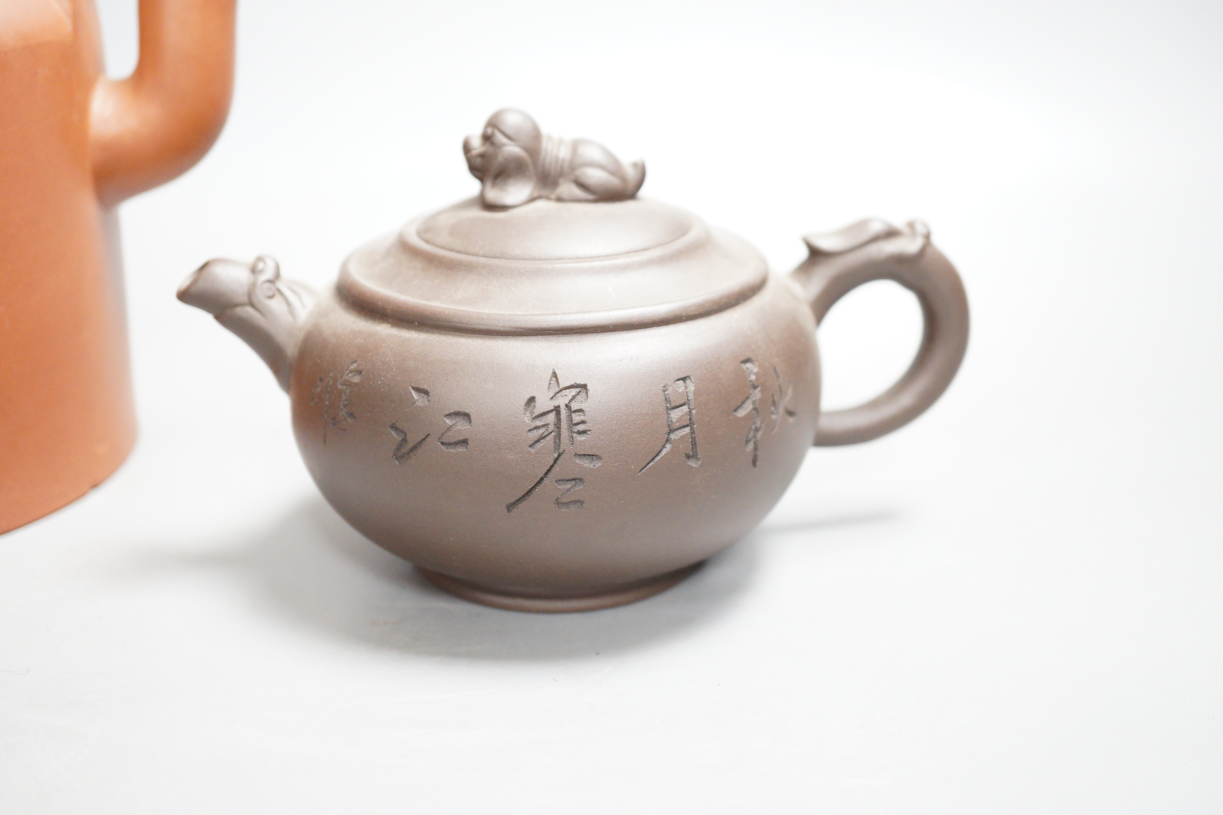 Two Chinese Yixing teapots and two similar teabowls. Tallest 14cm